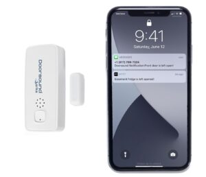 white door sensor and receiver beside a smart phone showing an alert of the freezer door remaining open
