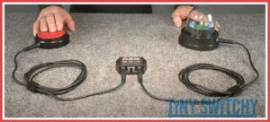 Tiny Switchy Latching/Timed Switch Modifier attached to a switch and a switch adapted device