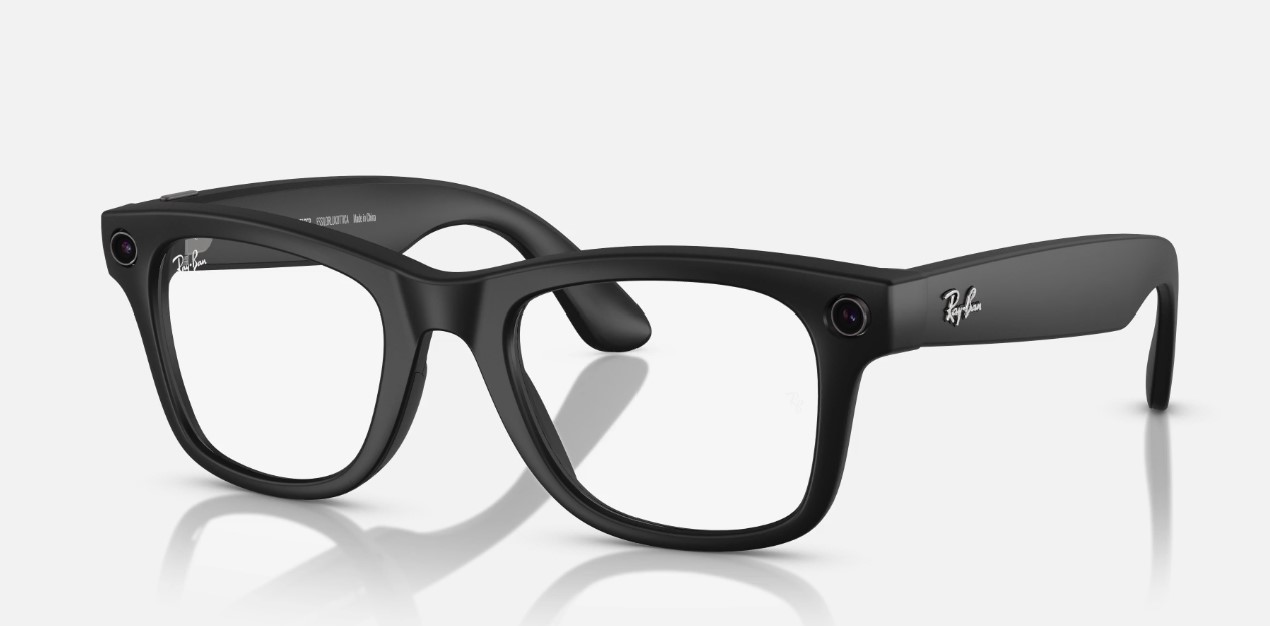 Black, plastic frame glasses with clear lenses. Circles at the front of the glasses frames on both sides are cameras