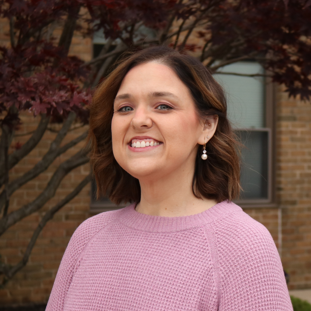 Image of LaTisha with short brown hair and a mauve sweater