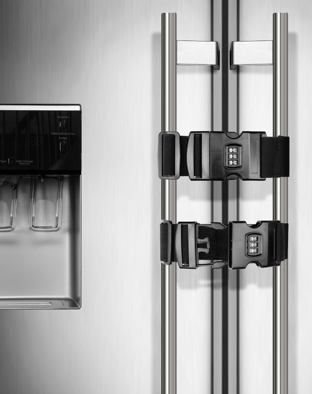 Stainless steel refrigerator with ice and water dispenser and french foors. Two locking straps with combination locs are on the door handles.