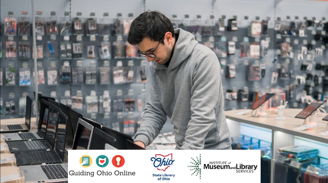 man looking at laptop computers