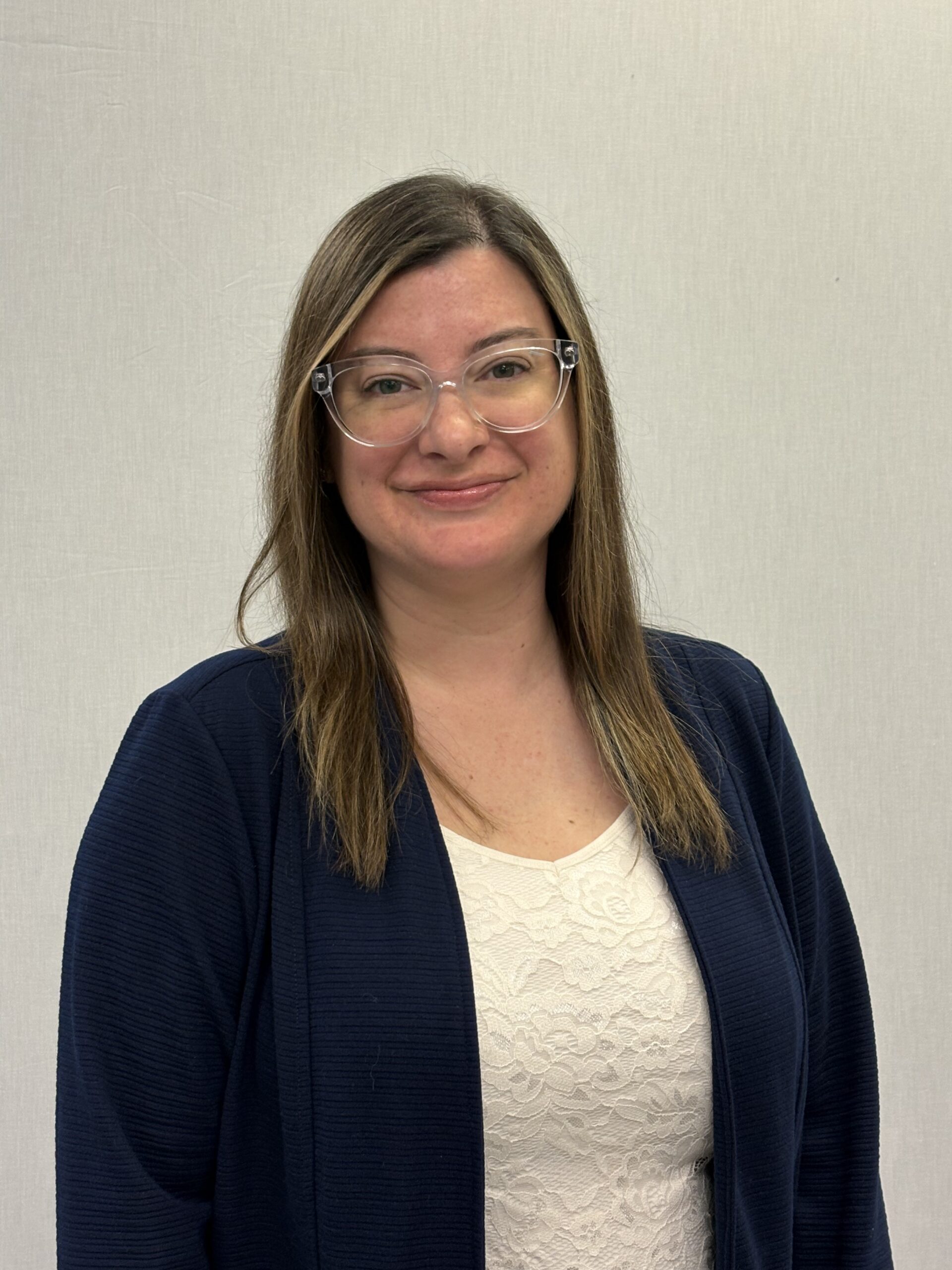 woman with glasses smiling