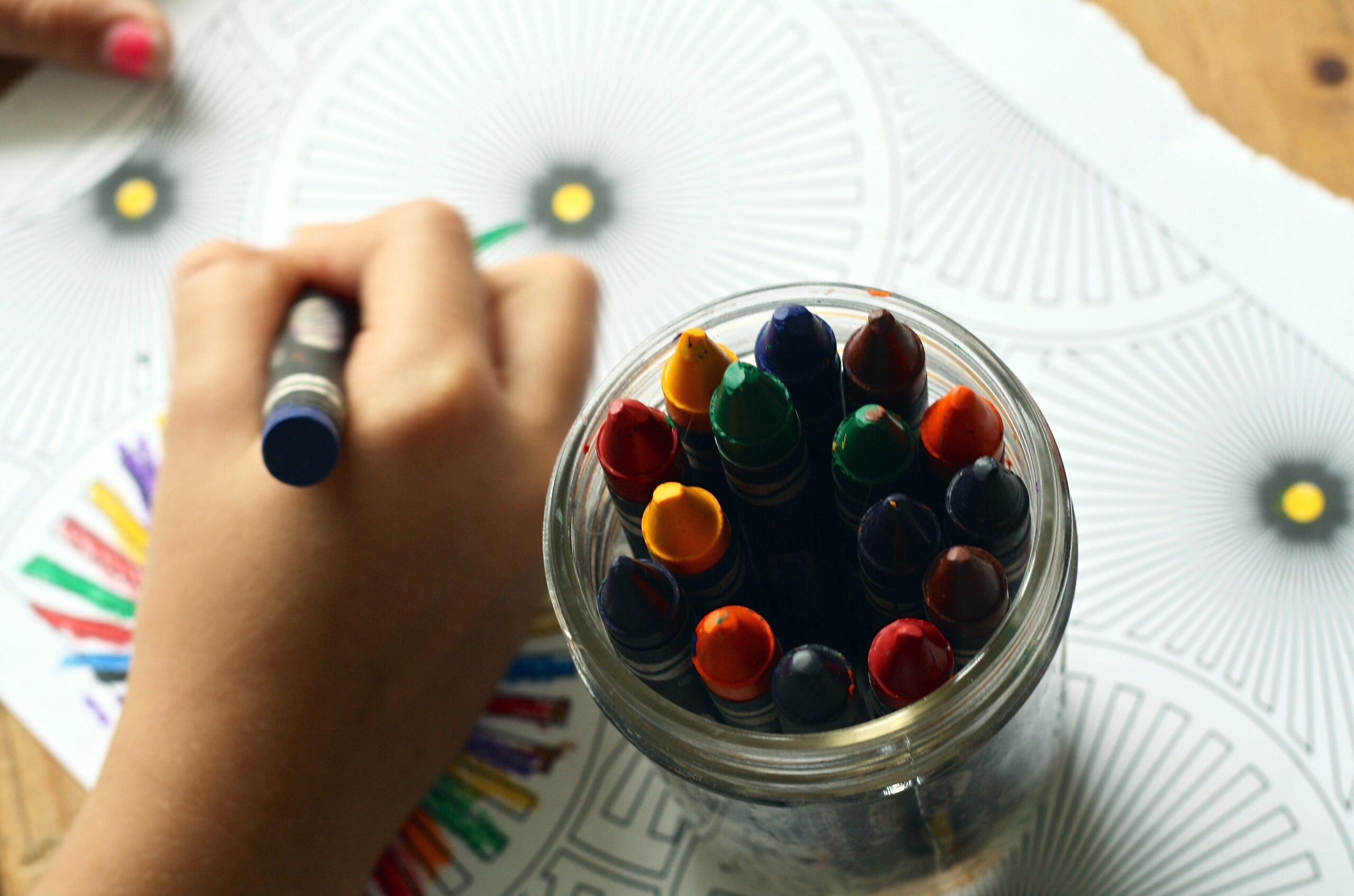 child's hand coloring