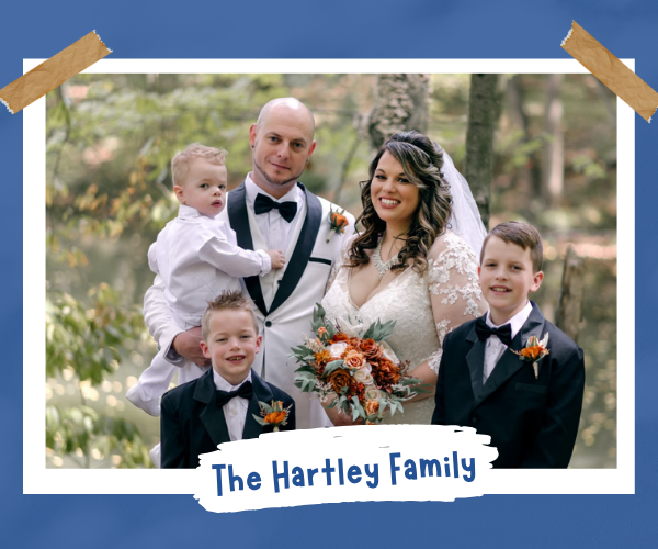 Wedding photo of the Hartley family which includes Marjorie Hartley, her husband, and three children. 