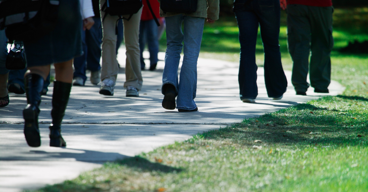 Stock image of a group of people walking.